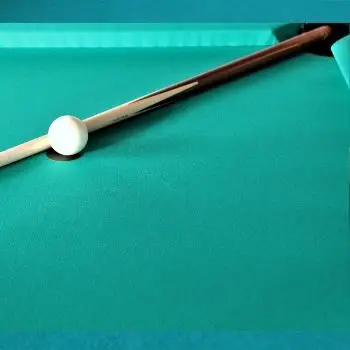 pool cue next to cue ball