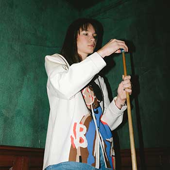Girl holding a pool cue